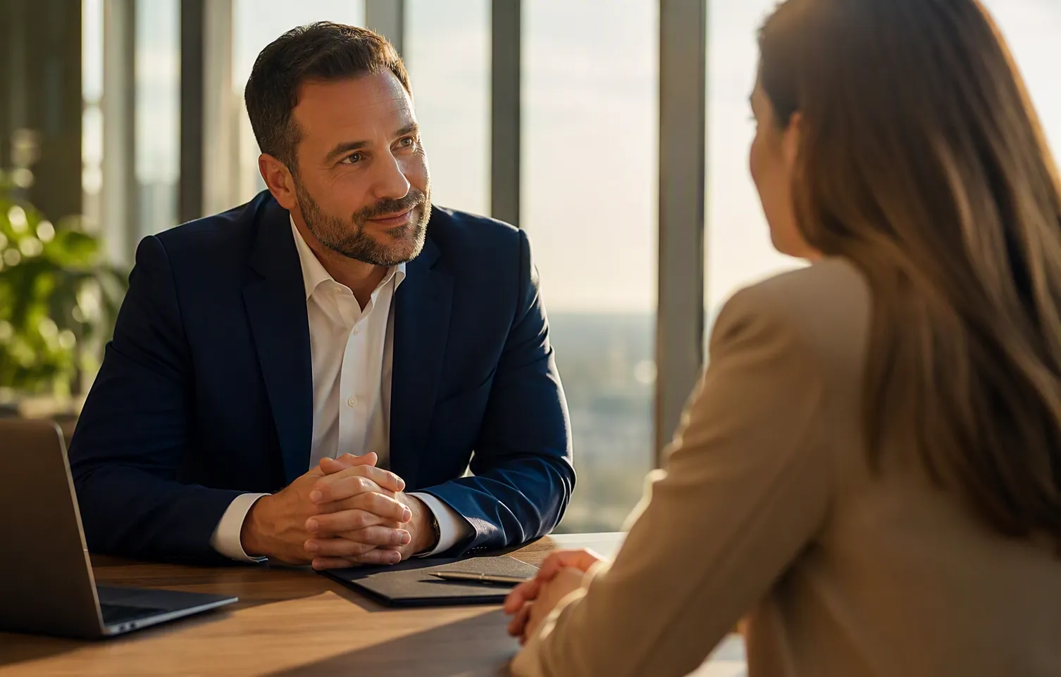 Advisor consulting with a client across a desk